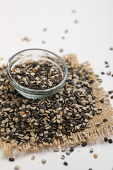Split Black Lentil Also Know as Black Gram, Black Urad Dal, Vigna Mungo, Urad Beani glass bowl on white background
