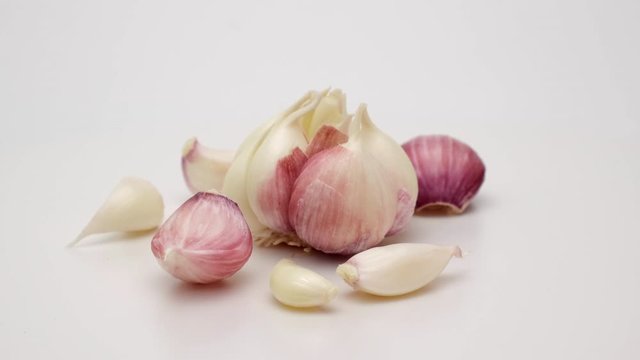 Head garlic 360 rotation. Shot on a white background.