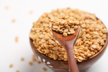 pigeon pea also known as toor dal in wooden bowl and spoon