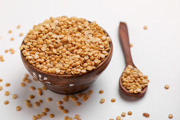 pigeon pea also known as toor dal in wooden bowl.