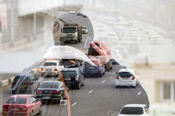 Double exposure of an urban landscape and a man calling on a smartphone
