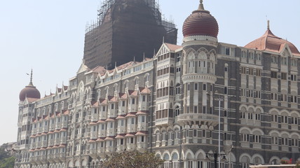 Mumbai, Maharastra/India- March 27 2020: An iconic hotel building getting some repair and reconstruction.