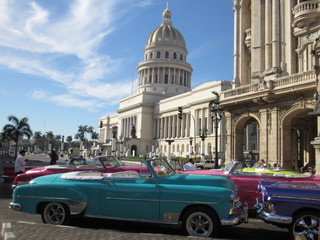 Havana,Cuba - January 24, 2020 : American convertible vintage cars parked on the main street in Havana Cuba.