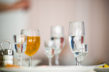 wedding, festive table, glasses, bottles of champagne and alcoholic cocktails