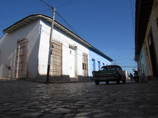 Trinidad,Cuba - January 31, 2020 : American convertible vintage cars parked on the main street in Trinidad Cuba