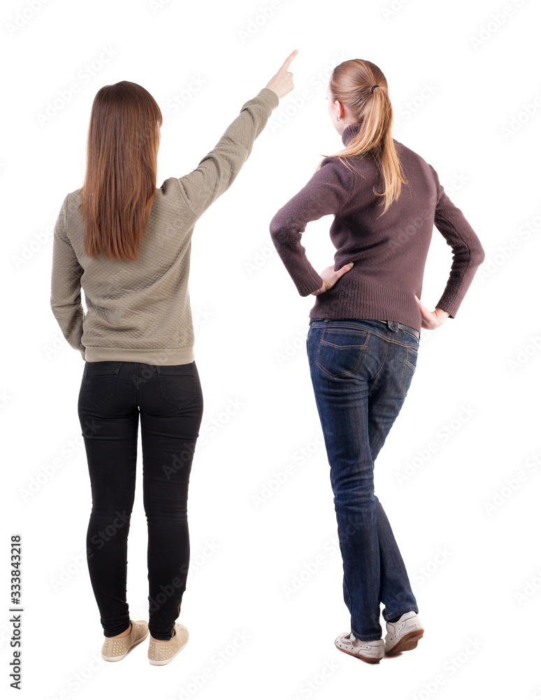 Canvas Prints Back view of two pointing girl in sweater.