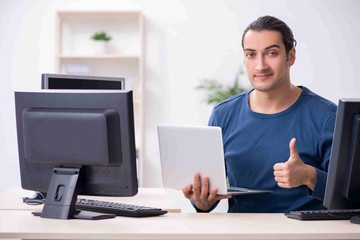 Young male it specialist working in the office