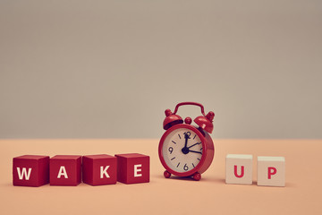 Rouse from sleep. Stop sleeping. Start new day. Awakening. Wake up inscription on wooden cubes....