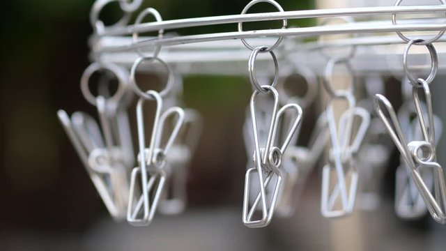 A swinging stainless clothespin.