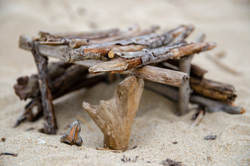 self made wooden decorations on the beach