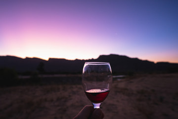 Wineglas in africa with the sunset in background