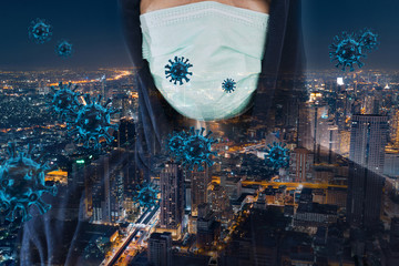 Double exposure of man wearing a mask with a bird's eye view of the city at night with 3d model of...