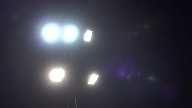 Lights flashing in the night pulsing floodlights 4K