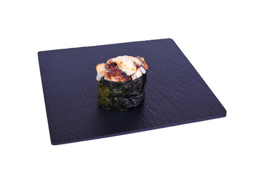 Traditional fresh japanese sushi on black stone Gunkan kaji unagi on a white background. Gunkan ingredients: eel, cheese mix, nori, rice.