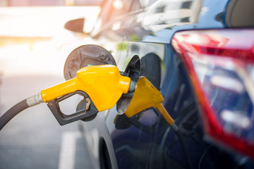 Close up of car is refilling oil fuel in Gas Station