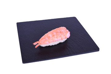 Traditional fresh japanese sushi on black stone Nigiri ebi on a white background. Gunkan...