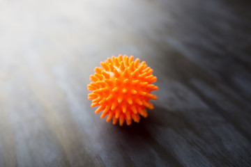 Novel coronavirus 2019-nCoV with copy space for text on dark background. Abstract virus strain orange model of Coronavirus disease COVID-19. Virus Pandemic Protection Concept