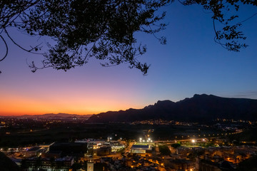 Sunset view to the mountains and the center of Orihuela, Spain