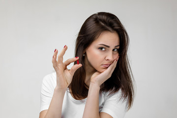Fototapeta premium young sad woman with medicine suffering from tooth pain, caries. girl having toothache and taking pill. Dental health and care concept