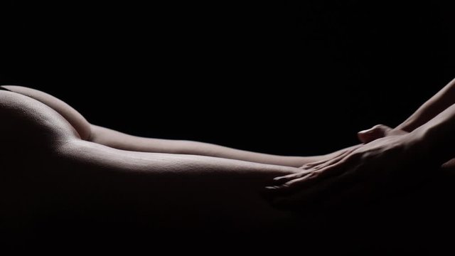 Massage priests close-up on a black background. Slow motion.