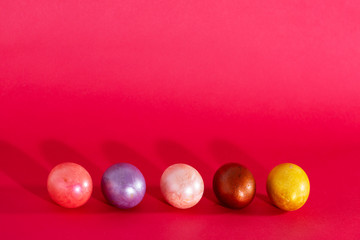 Easter painted eggs isolated on red background