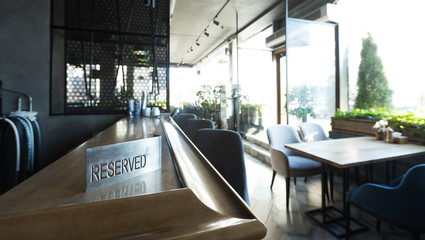 Reserved table in modern cafe or restaurant with panoramic windows