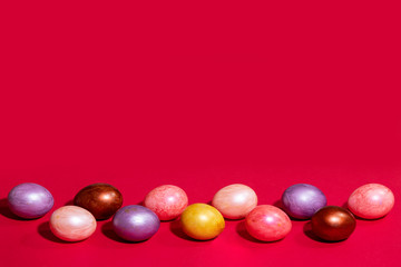 Easter painted eggs isolated on red background