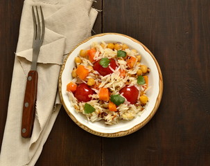 Rice with pumpkin, chickpeas and cherry, top view, copy space