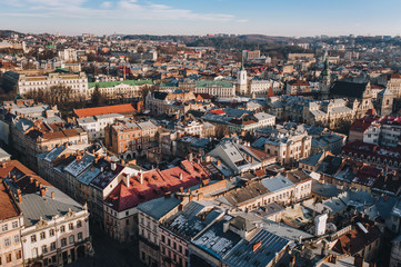 Fototapeta premium View of the old city from above, from the observation tower of the town hall. Lviv, Ukraine, autumn panorama.
