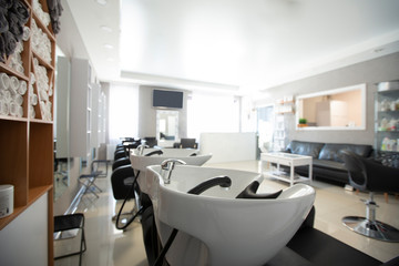 Focus on sink for washing hair. Beauty salon