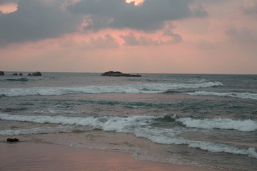 indian ocean at sunset in sri lanka