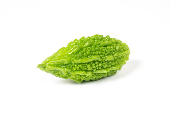 Bitter gourd on a green background.