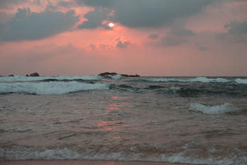 indian ocean at sunset in sri lanka
