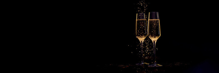 Banner Glasses of champagne with black background and lights