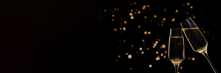 Banner Glasses of champagne on black background with lights © Mary