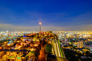 Skyline at sunset from a rooftop bar in Bangkok, Thailand