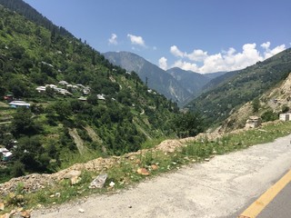 clear sky below green trees in Naran Pakistan