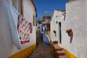 Fototapeta premium Old whitewashed houses in the medieval fortress of Obidos, Portugal