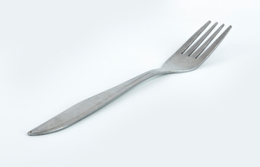 Metal stainless fork isolated with white background
