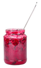 Glass jar with tasty currant jam on a table on tablecloth