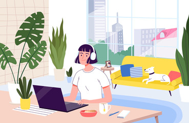 Young woman freelancer works remotely from her apartment. The concept of distant work during the quarantine and isolation of coronavirus