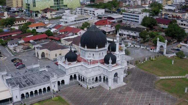 4k Aerial Footage of Masjid Zahir Mosque in Alor Setar Kedah. Orbit Shot with shophouse background