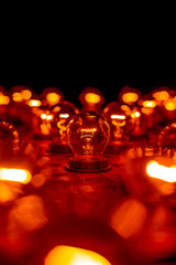Bare bulb mobile wallpaper. Red bokeh lights and dark background. Analog life. Vintage styled...