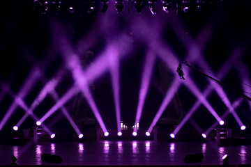 stage light with colored spotlights and smoke, concert scene