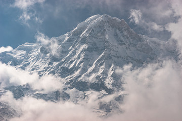 Fototapeta na wymiar Annapurna mountain peak above the cloud in Himalaya mountain range, Pokhara, Nepal