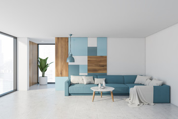 White living room interior with blue sofa