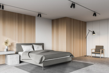 Armchair in white and wooden bedroom