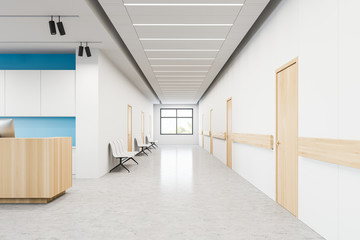 Hospital corridor with chairs and reception