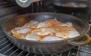Chicken frying in a pan
