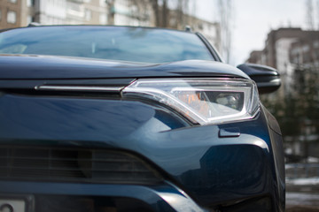 Obraz na płótnie Canvas car headlights blue wheel windshield